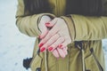 Girls hands in cold in winter day